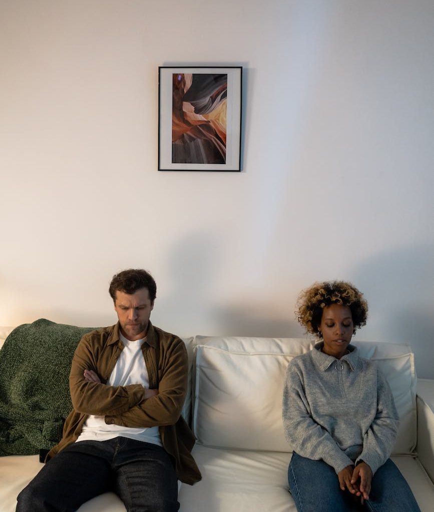 a couple sitting on the sofa