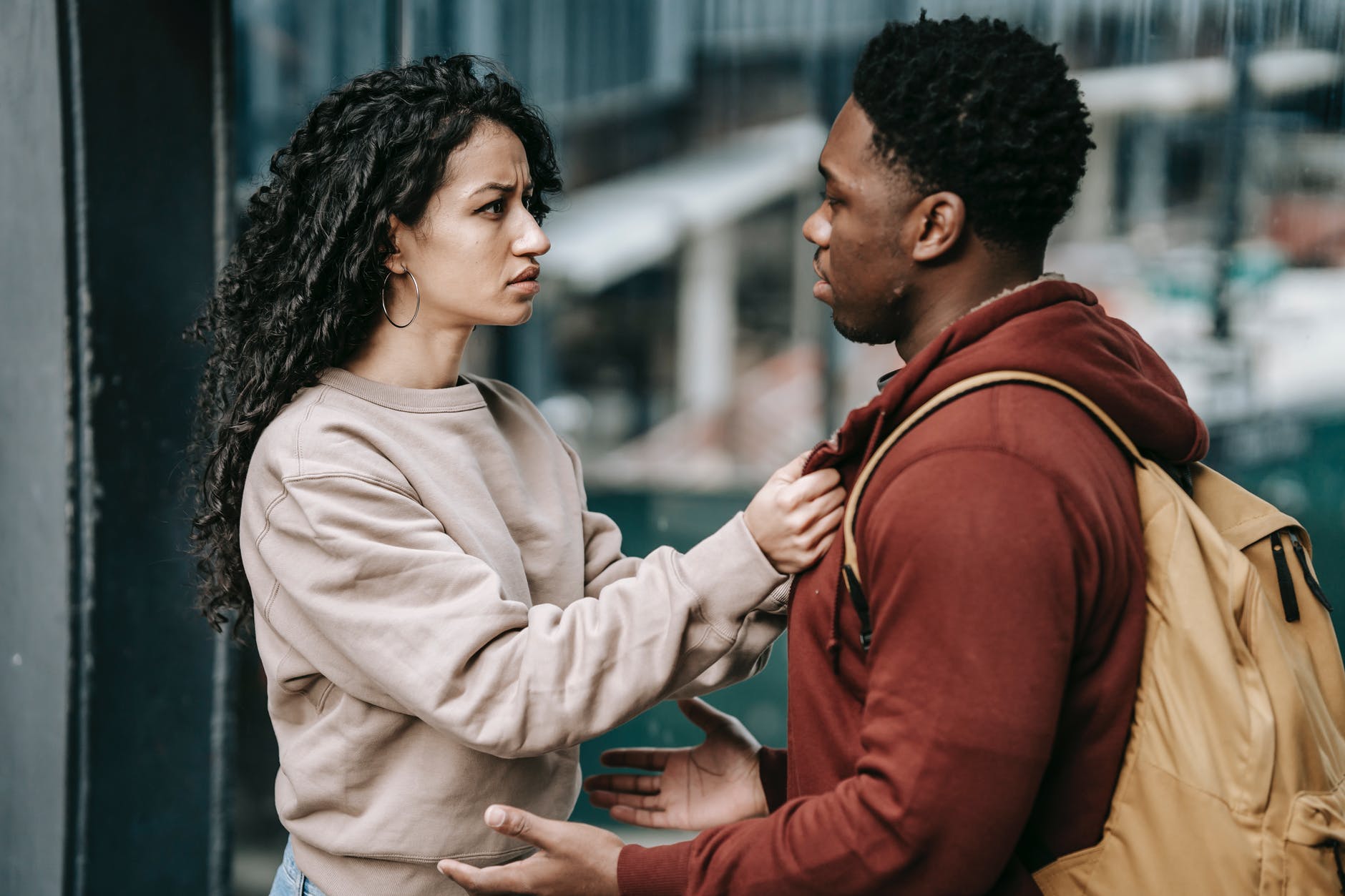 young couple talking on street