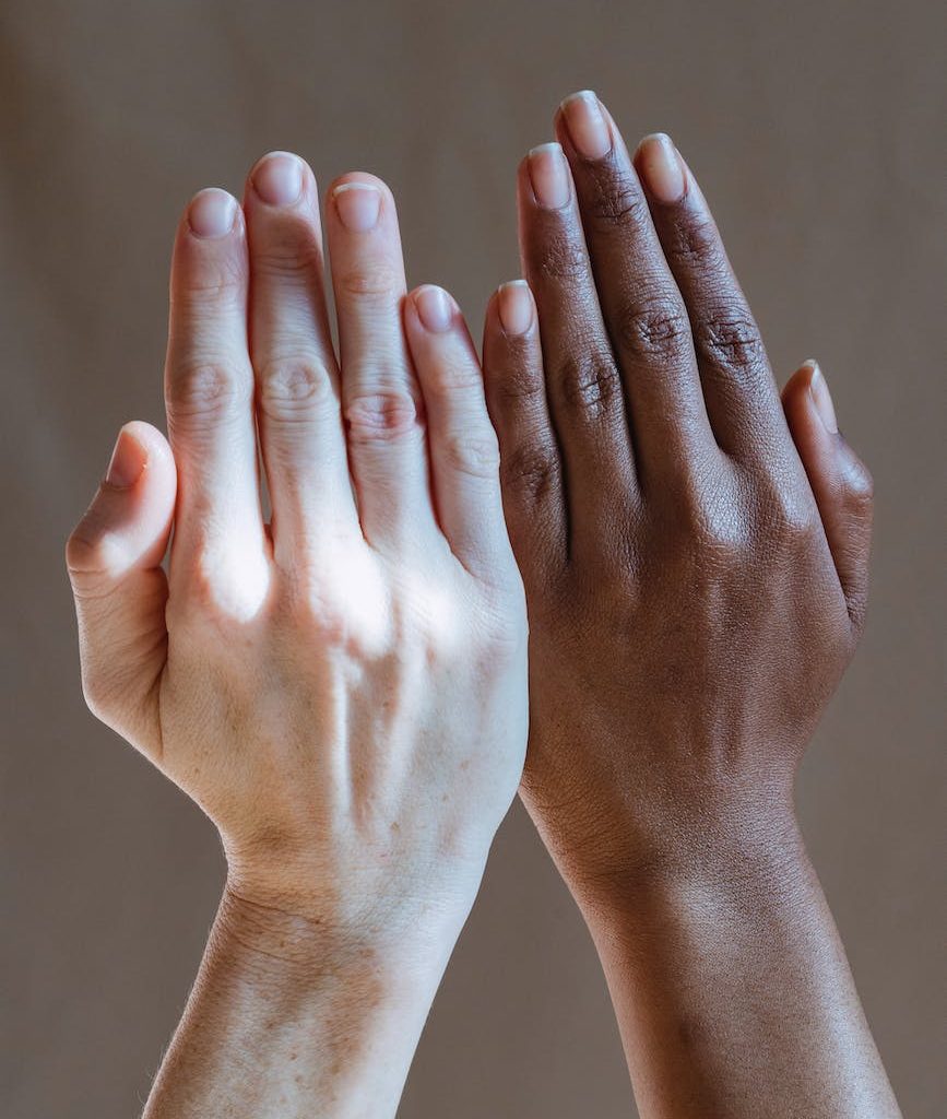 diverse women showing hands in studio